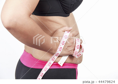 Fat woman pinching her fat on white background. Fat woman pinching her fat on white background. 44479624