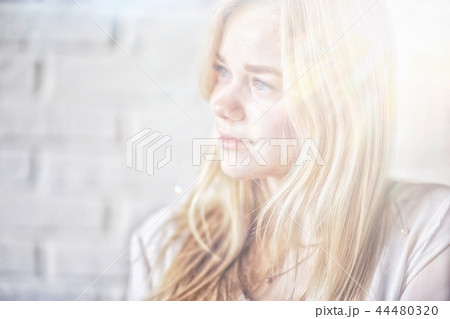 young blonde long hair / portrait of a young adult beauty with long blond hair 44480320