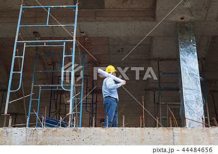 Construction concepts, Engineer and Architect working at Construction Site with blueprint Construction concepts, Engineer and Architect working at Construction Site with blueprint 44484656