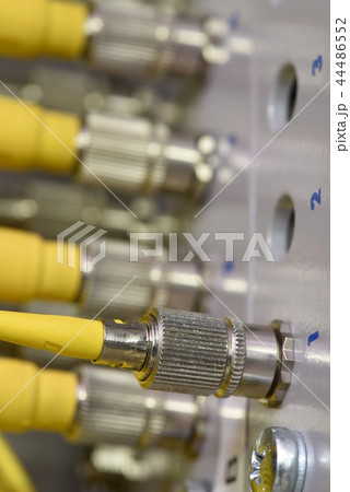 Fiber optic cables connectors close-up 44486552