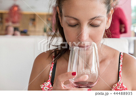 Young woman drinking wine Young woman drinking wine 44488935