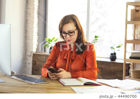 Businesswoman holding phone. Businesswoman holding phone. 44490700