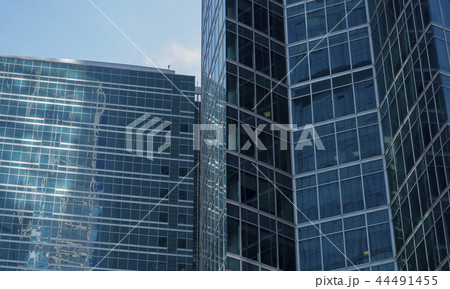 modern glass and steel office buildings in lower manhattan with blue sky modern glass and steel office buildings in lower manhattan with blue sky 44491455