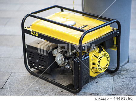 Gasoline Portable Generator on the House Construction Site. Close up on Mobile Backup Generator 44491560