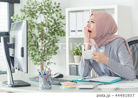 Muslim office lady yawning, working at office job 44491937