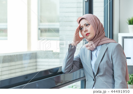 Muslim lady resting because of annoyed customer Muslim lady resting because of annoyed customer 44491950