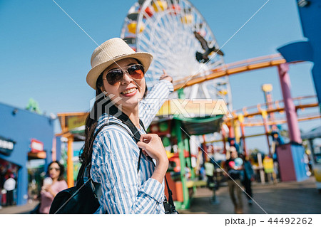 traveler pointing to the Ferris wheel 44492262
