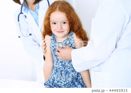 Doctor examining a little girl with stethoscope.Medicine and healthcare concept Doctor examining a little girl with stethoscope.Medicine and healthcare concept 44493915