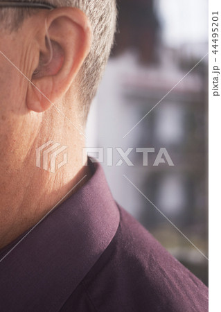 Deaf man hearing aid ear 44495201