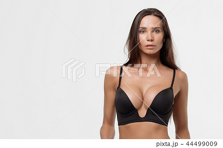 Young beautiful girl shows her gorgeous Breasts Stock Photo by ©3kstudio  189838340