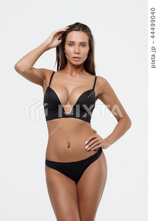 Young beautiful girl shows her gorgeous Breasts - Stock Photo 44499040