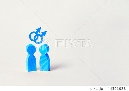 two blue wooden figures of people stand 44501028