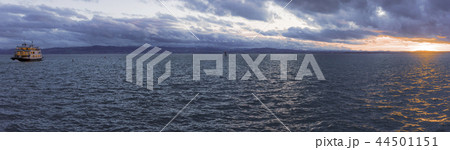 Panorama at sunset with a boat Panorama at sunset with a boat 44501151