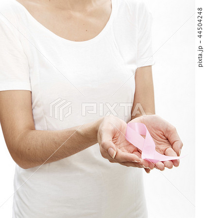 Woman holding a pink ribbon. Woman holding a pink ribbon. 44504248