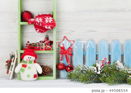 Christmas snowman toy, decor and fir tree branch 44506554