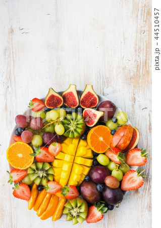 Rainbow fruits berries on white wood 44510457