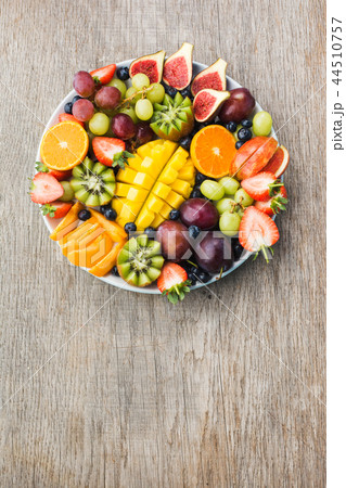 Rainbow fruits top view on grey 44510757