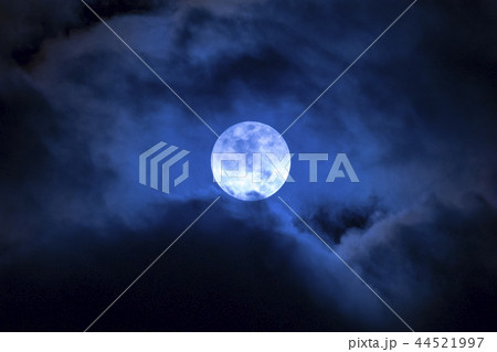 Dark night full moon in the clouds Dark night full moon in the clouds 44521997