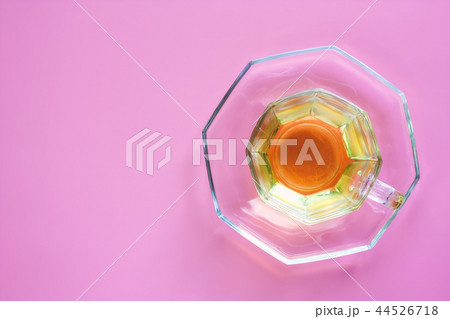 Cup of tea on pink background 44526718