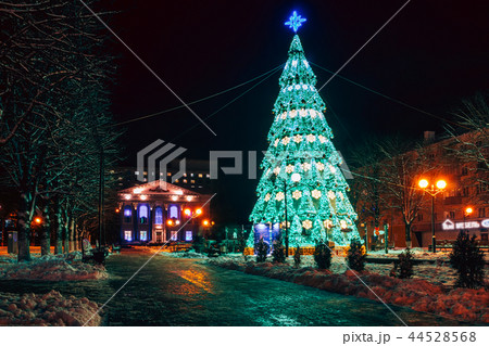 Beautiful urban Christmas tree green illumination Beautiful urban Christmas tree green illumination 44528568