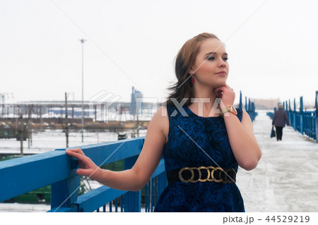 Beautiful frozen girl on bridge at winter 44529219