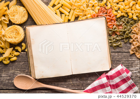 Various types of italian pasta and blank cookbook. Various types of italian pasta and blank cookbook. 44529370