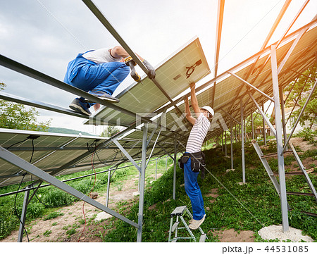 Installing of solar photo voltaic panel system 44531085