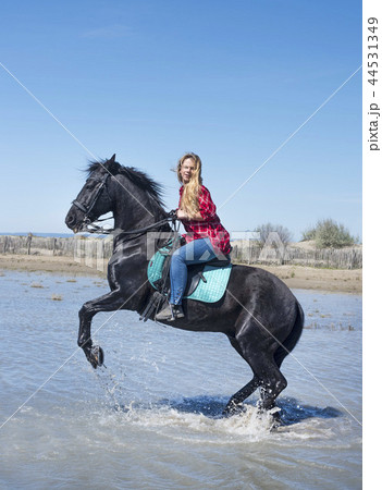 riding woman on the beach 44531349