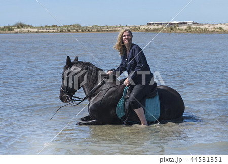 riding woman on the beach 44531351
