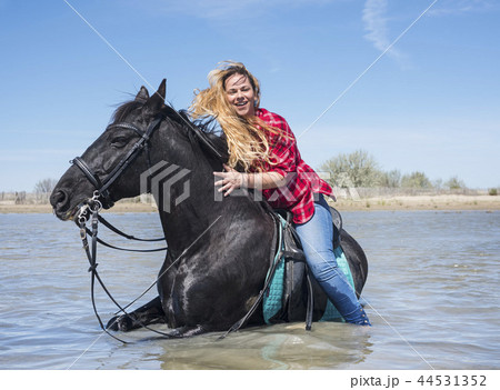 riding woman on the beach 44531352