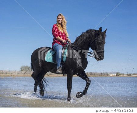 riding woman on the beach 44531353