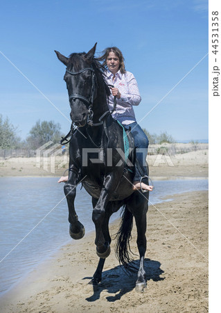 riding woman on the beach 44531358