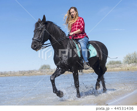 riding woman on the beach 44531436