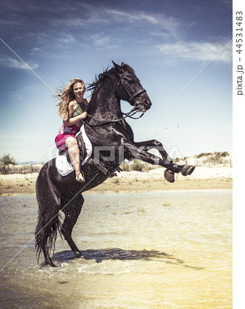 woman and rearing horse 44531483