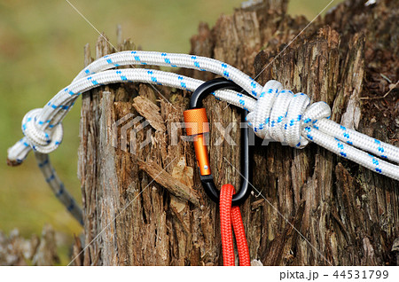 Metal carabine and rope . Photo of carabines. Metal carabine and rope . Photo of carabines. 44531799