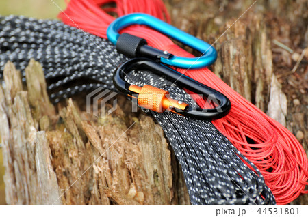Metal carabine and rope . Photo of carabines. Metal carabine and rope . Photo of carabines. 44531801