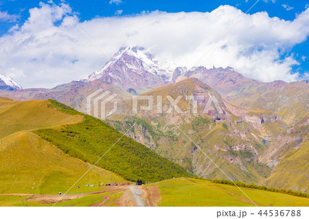 Mount Kazbek beautiful view from Gergeti Trinity Church Tsminda Sameba in summer sanny day. It is a 44536788