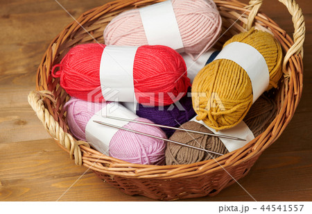 colorful wool threads for knitting on wooden colorful wool threads for knitting on wooden 44541557