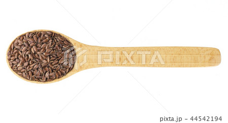 Flax seeds in wooden spoon isolated on white background Flax seeds in wooden spoon isolated on white background 44542194