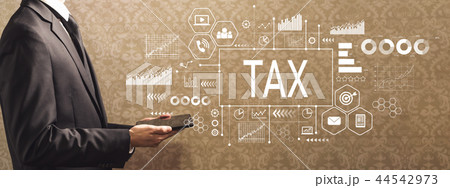 Tax with businessman holding a tablet computer  44542973