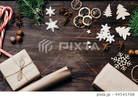 Gift boxes, wrapping paper and decorations, flat lay 44543708