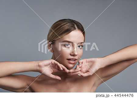 Cute woman putting two hands together and looking at you Cute woman putting two hands together and looking at you 44544476