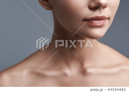 Close up of beautiful woman having natural lipstick 44544483