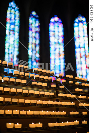 Rows of firing candles in catholic church. Rows of firing candles in catholic church. 44545354