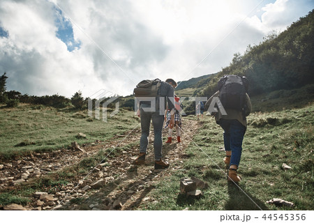Brave backpackers are doing ascent on top Brave backpackers are doing ascent on top 44545356