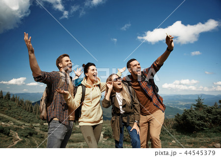 Merry friends are taking selfie in mountains Merry friends are taking selfie in mountains 44545379