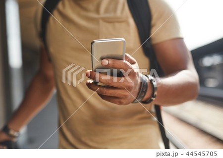 Selective focus of male hands with a smartphone 44545705