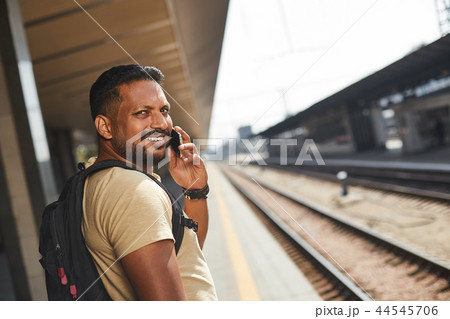 Cheerful hindu man talking on his phone 44545706