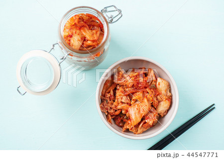 Kimchi cabbage in a bowl and jar with chopsticks 44547771