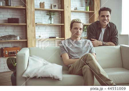 Happy gay couple posing at their apartment 44551009